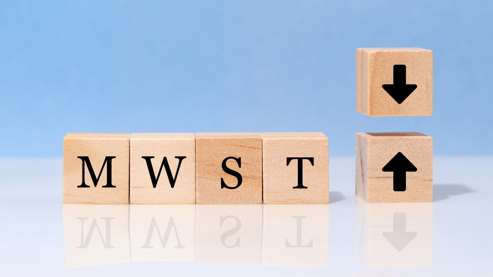 Würfel mit MWST-Schriftzug