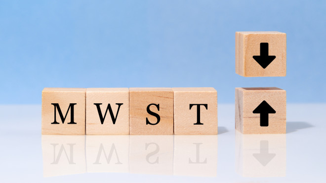 Würfel mit MWST-Schriftzug